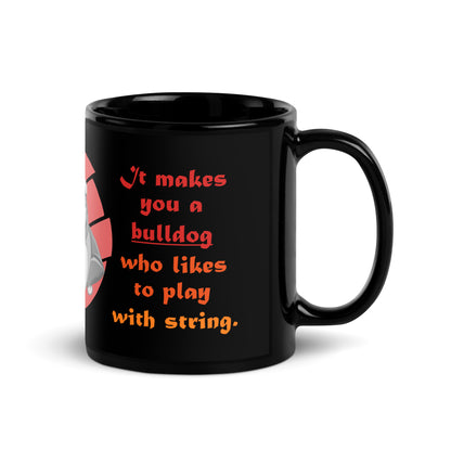 A003 Mug - Black Glossy Ceramic Mug Featuring Papa Bulldog Telling His Son, “Playing with String Doesn’t Make You a Cat.”