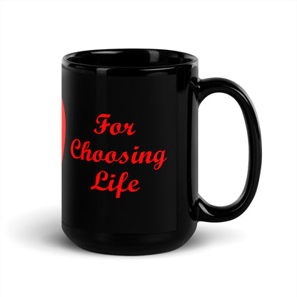 A002 Mug - Black Glossy Ceramic Mug Featuring Mother and Baby Graphic with text “Thank Your Mother For Choosing Life.”