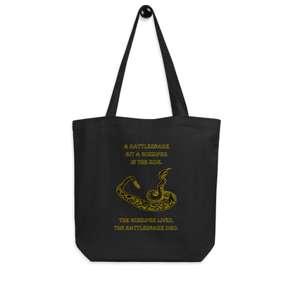 A010 Tote – Eco Tote Bag Featuring a Rattlesnake Graphic and the Text “A Rattlesnake Bit a Gossiper in the Side – The Gossiper Lived, The Rattlesnake Died.”