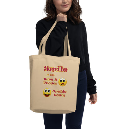 A008 Tote – Eco Tote Bag Featuring a Smiley Graphic With the Text “Smile - It Can Turn a Frown Upside Down”