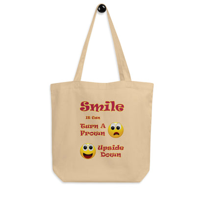 A008 Tote – Eco Tote Bag Featuring a Smiley Graphic With the Text “Smile - It Can Turn a Frown Upside Down”