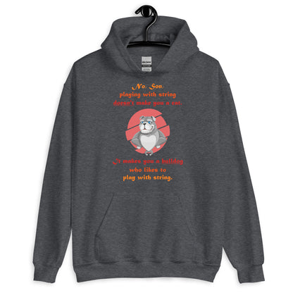 A003 Hoodie – Gildan 18500 Unisex Hoodie Featuring Papa Bulldog Telling His Son, “Playing with String Doesn’t Make You a Cat.”